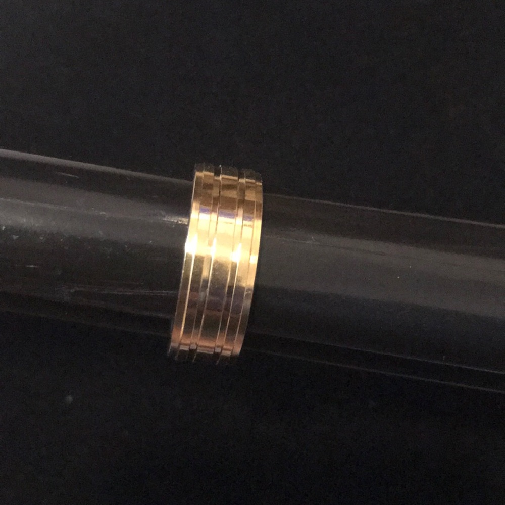 Gold stainless steel band ring. (11) Linear design